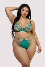 Load image into Gallery viewer, a woman wears a green cage-like bra with a matching high-waist thong. 
